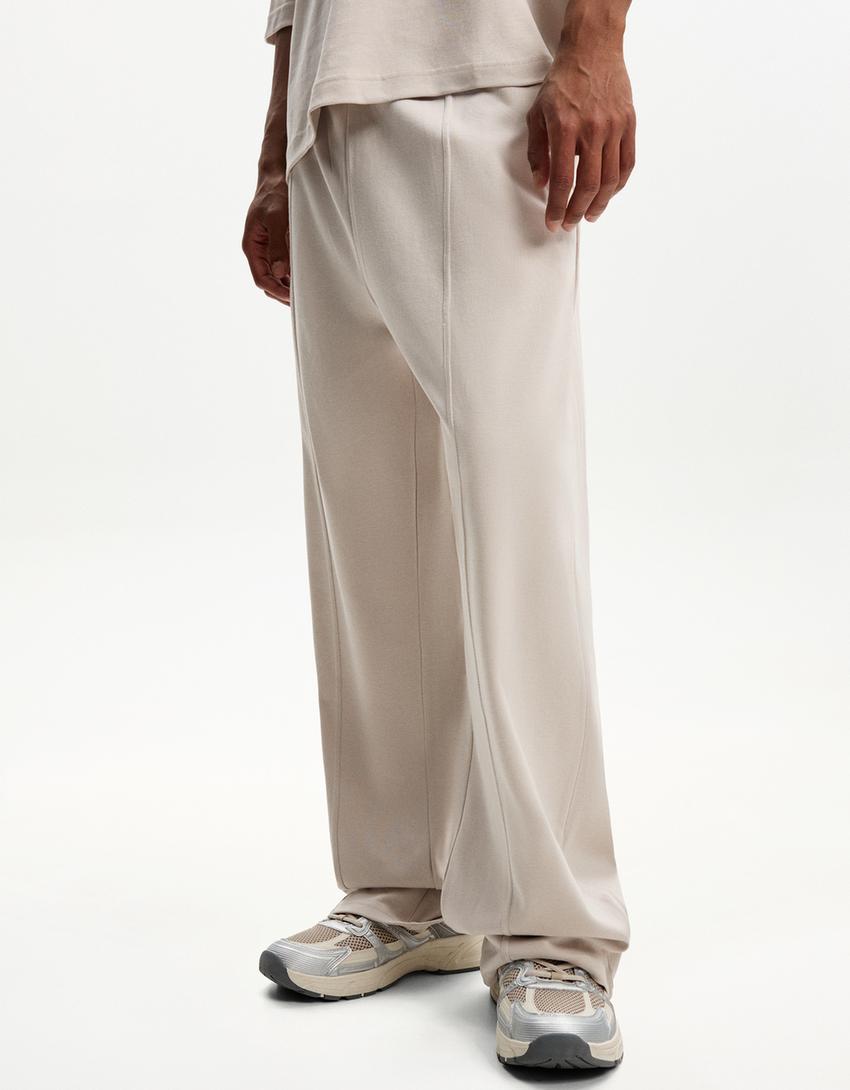 BERSHKA BAGGY TROUSERS IN BEIGE