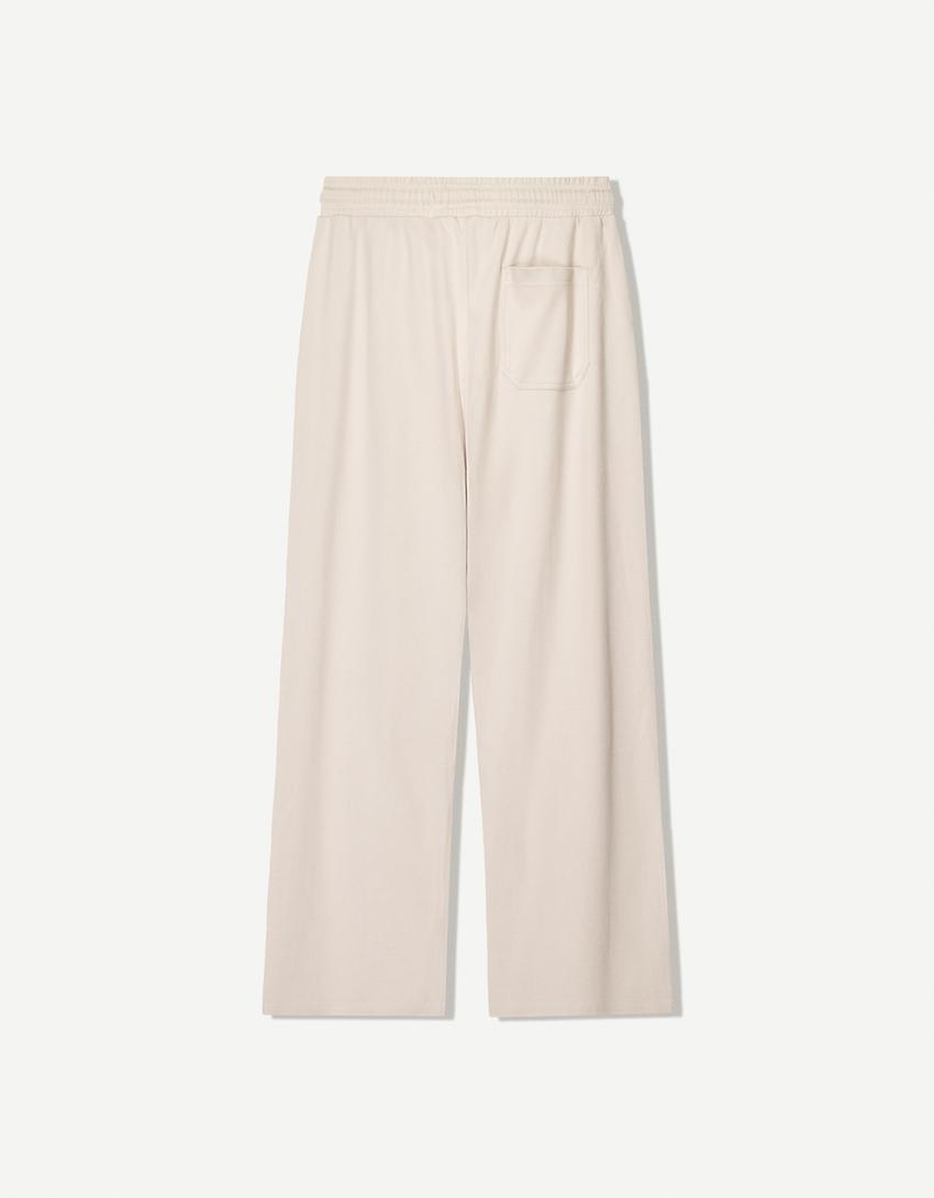 BERSHKA BAGGY TROUSERS IN BEIGE