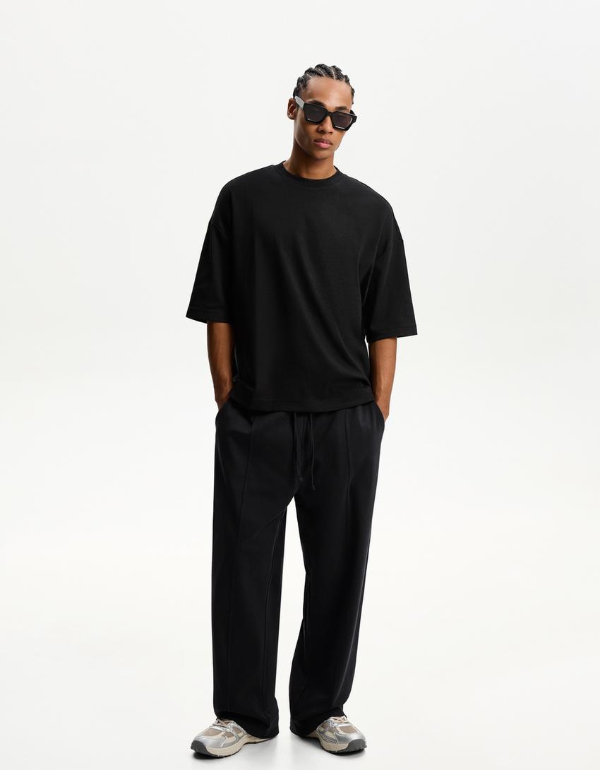 BERSHKA BAGGY TROUSERS IN BLACK