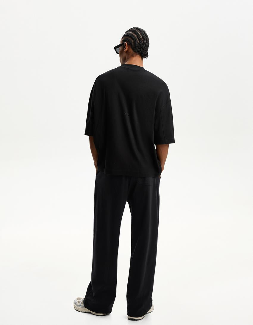 BERSHKA BAGGY TROUSERS IN BLACK